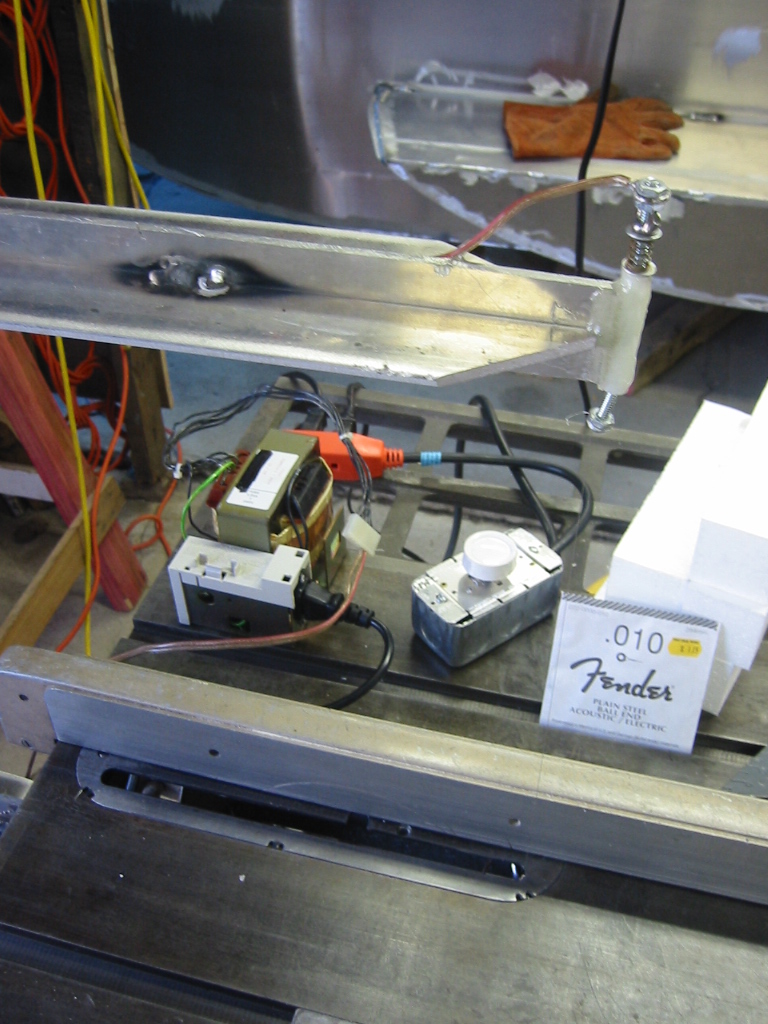 A 24 volt AC transform for power and a dimmer switch for temperature control.