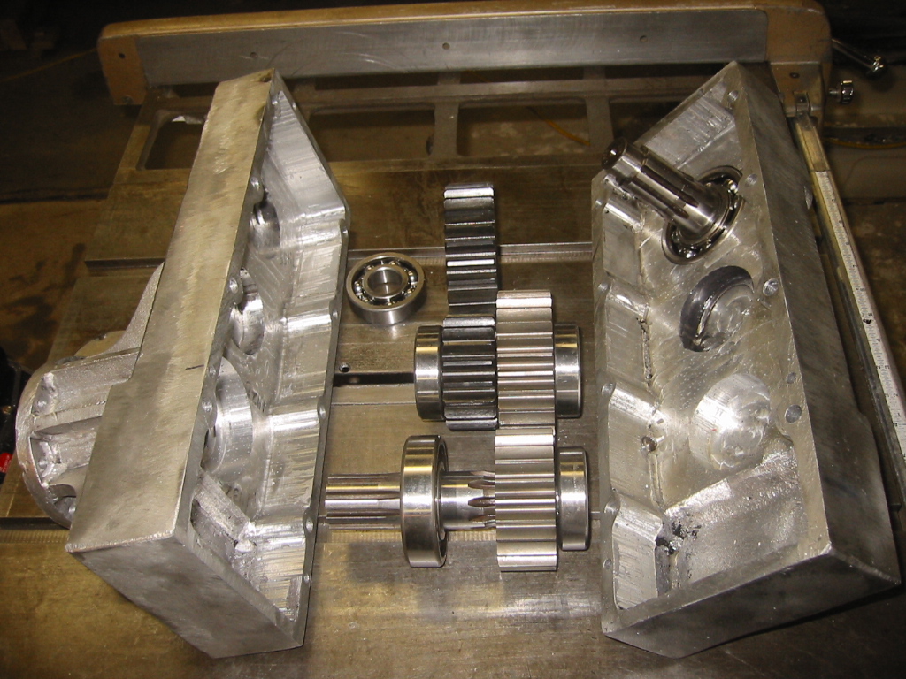 Completed gearbox with the drive shafts, bearings, and spur gears.