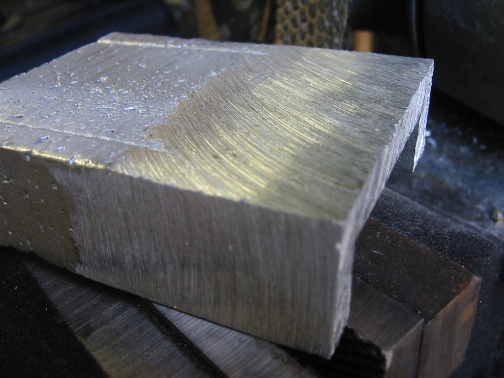 Sanding the foam with 400 grit sandpaper helps smooth the surface. The remainder of the texture left by the foam can be removed with a grinding disk.