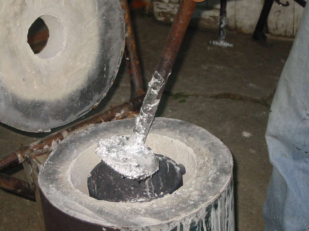 A tablespoon of flux was tossed in, pushed down and mixed in, and then the dross is skimmed off the top.