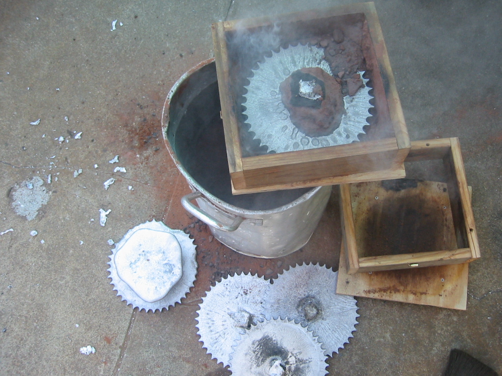 The part is allowed to cool for several minutes and the lifted out of the sand.