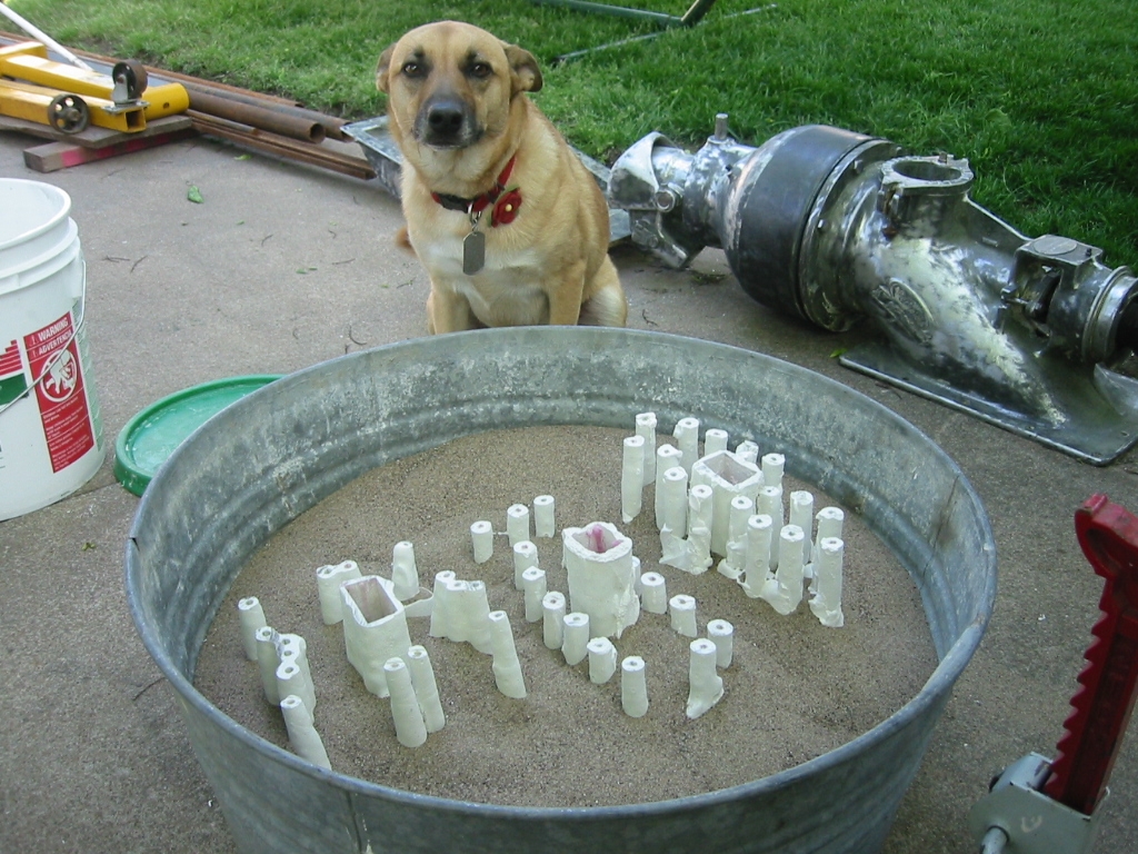 3 Sets of parts set in sand.