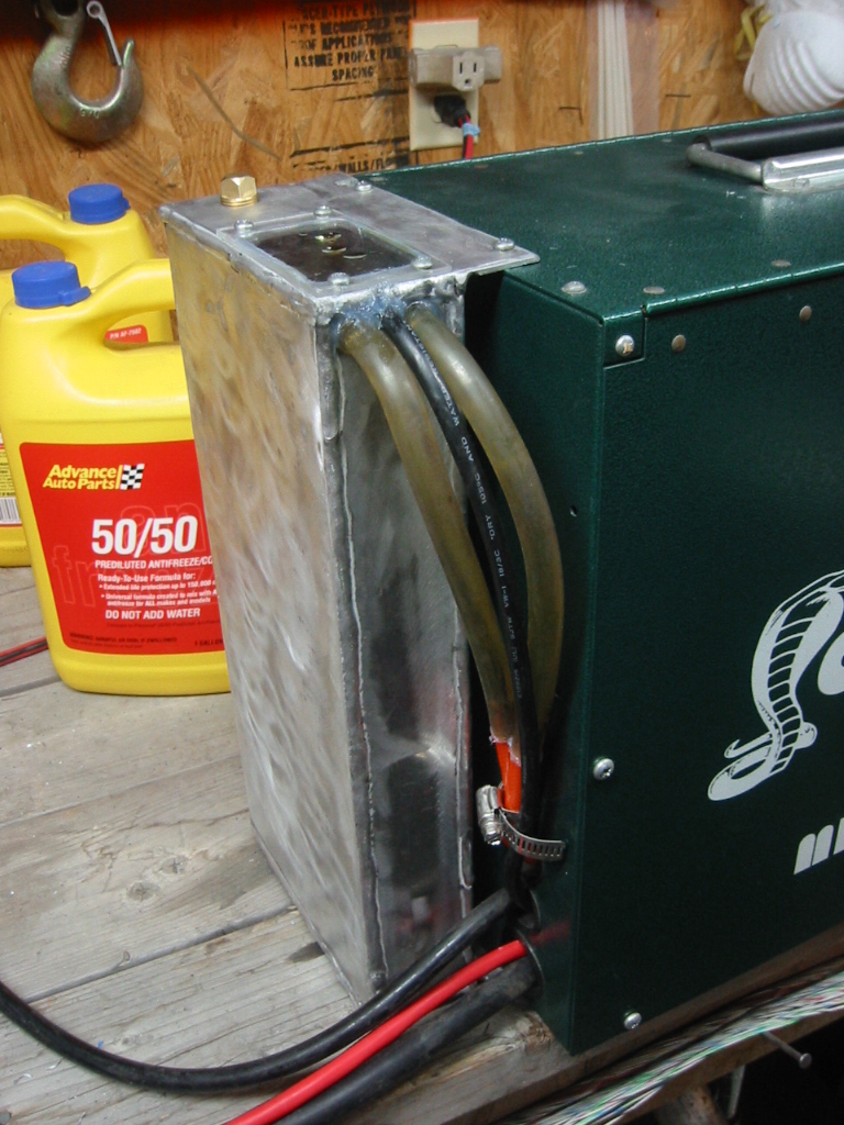 The coolant tank and pump are mounted on the back.