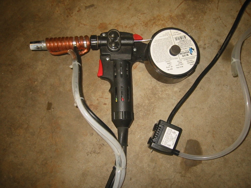 Spoolmate 185, spool gun with a DIY water cooled barrel. I added a home-make water cooling system for the barrel. The details for that are on the Welding Aluminum page.