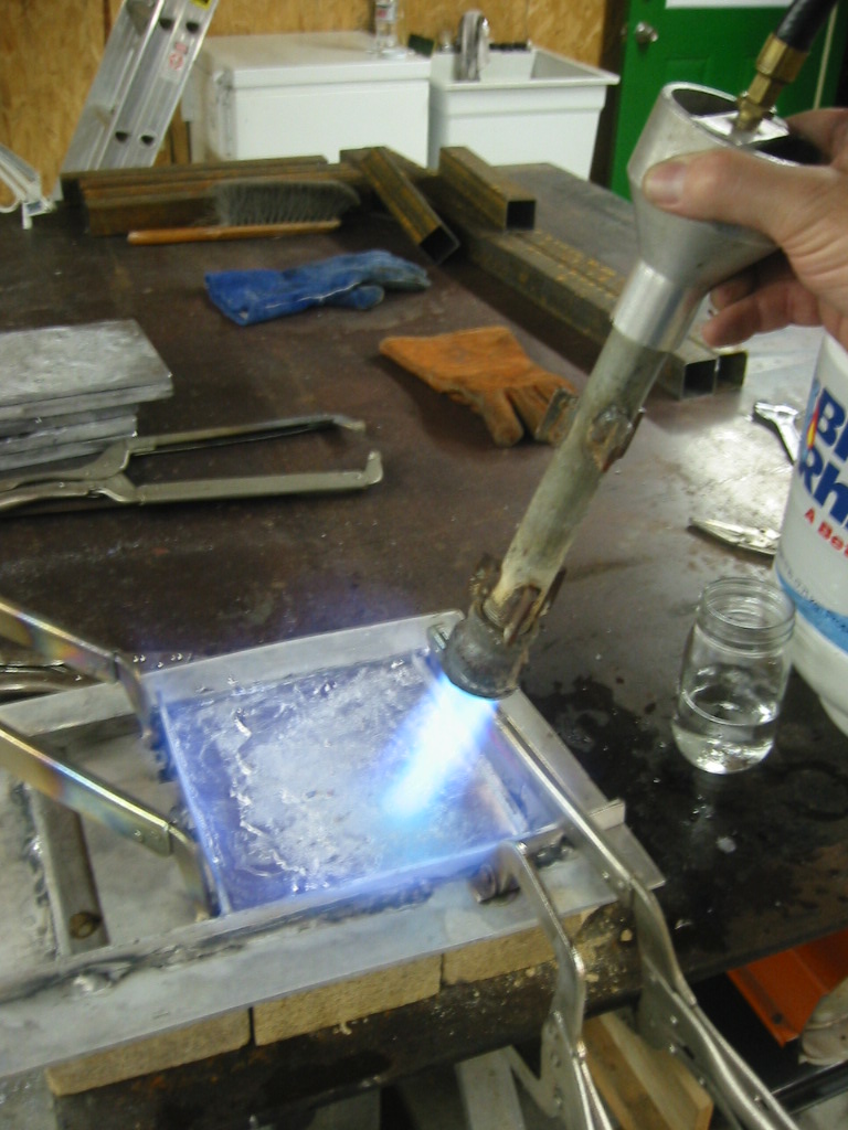 Melting the lead to smooth the surface.