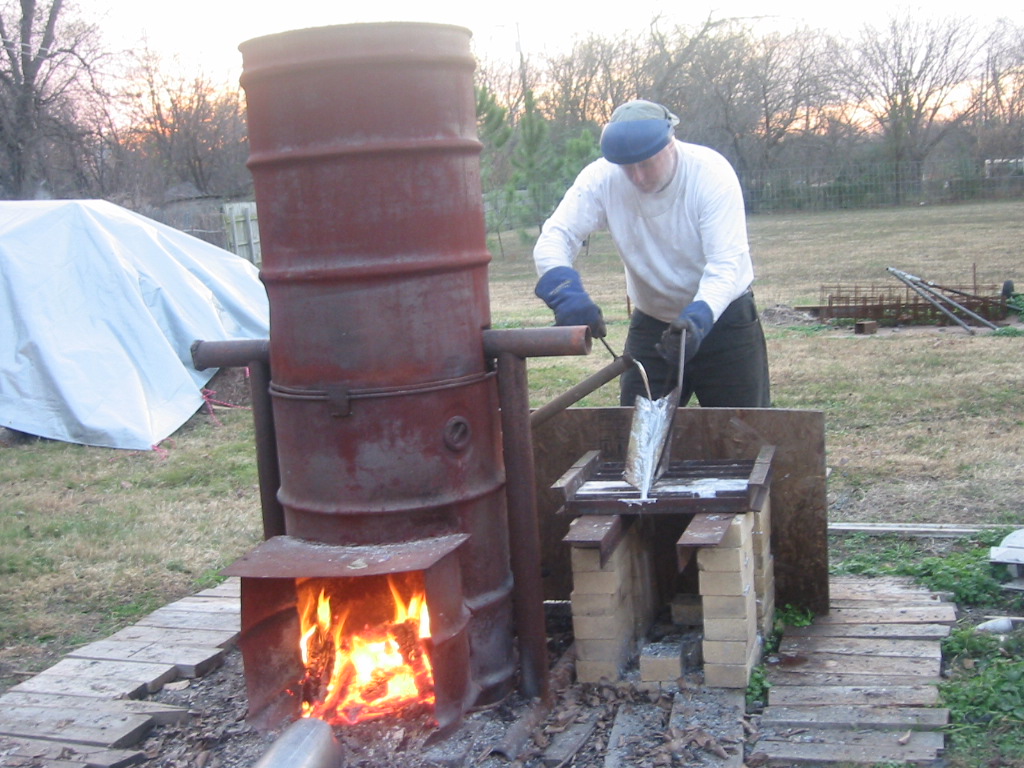 Pouring lead off the bottom the pot and down a piece of steel angle into the molds.