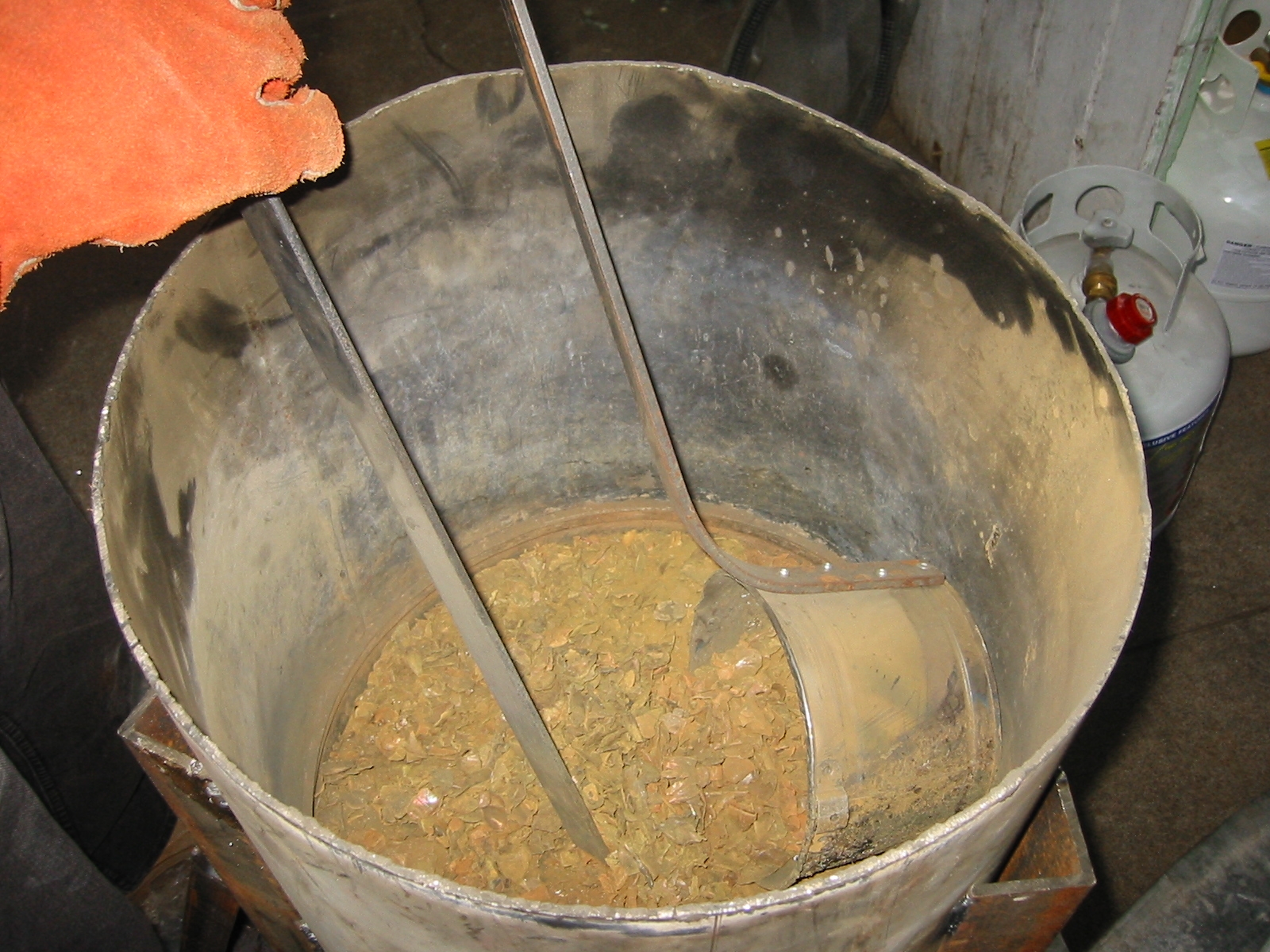 Removing brass and other trash from the surface.