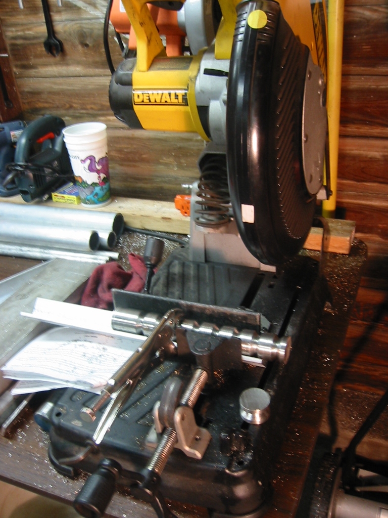 (4) Cutting the wheels apart in a cut-off saw.